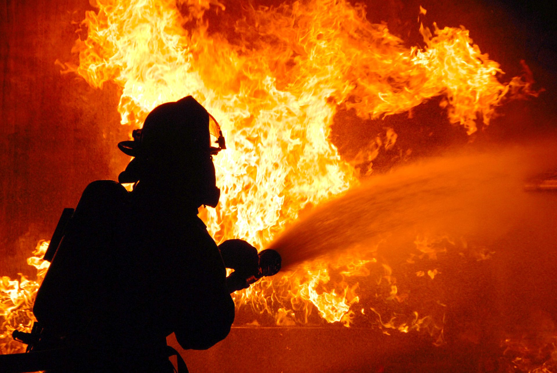 Firefighter putting out a fire